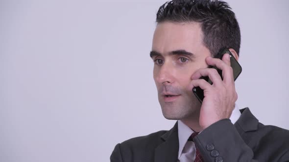 Face of Happy Handsome Businessman Talking on the Phone