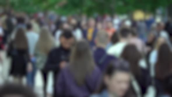 Silhouettes of People Walking in a Crowd Slow Motion