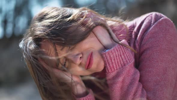 Headshot Portrait of Desperate Frustrated Caucasian Woman Holding Head in Hands Thinking Sitting