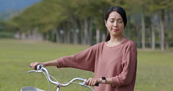 Woman ride a bike in countryside