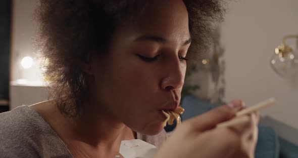 African American Woman Eating Delivery Food