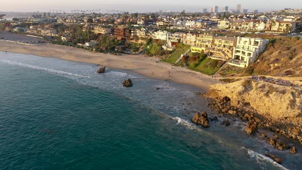 Million dollar luxury homes overlook the crystal clear blue ocean waters of the Sunny Southern Calif