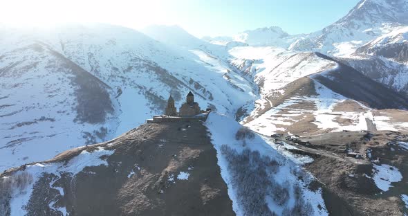 Aerial view of Gergeti Trinity Church, Tsminda Sameba in Kazbegi. Georgia 2022