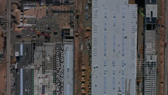 Generic Top View of a Big Construction Site with Building Structure and Heavy Machinery Equipment of