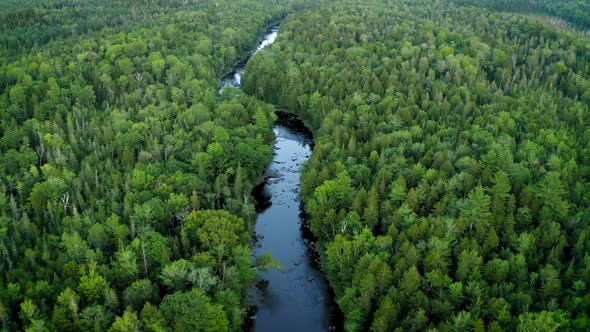 Aerial shot over Piscataquis River at Barrel Falls.