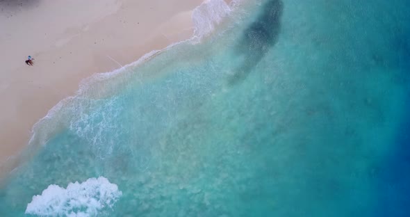 Beautiful aerial island view of a sandy white paradise beach and turquoise sea background 