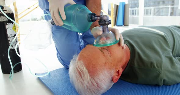 Male paramedic during cardiopulmonary resuscitation