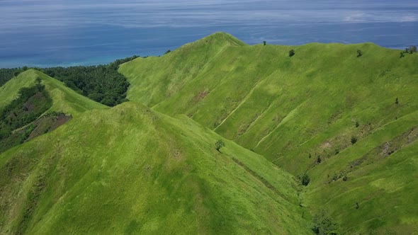 View of Tropical Blue Ocean Bay and Green Hills