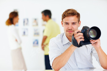 Photographer holding a camera