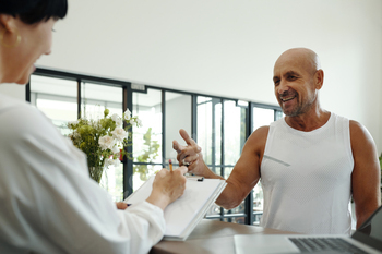 Man Registrating For Training In Wellness Club