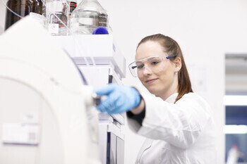 Scientist adjusting equipment in a laboratory