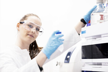 Scientist adjusting equipment in a laboratory