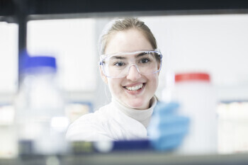 Young scientist smiling in the lab