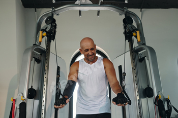 Man Exercising On Sport Equipment