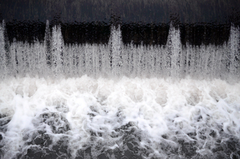 A picture of the flowing water. The dam is designed to regulate the water level