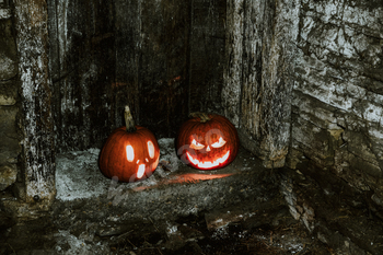 scary Halloween background with Jack'o'lanterns and skeleton