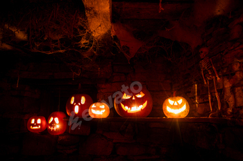 scary Halloween background with Jack'o'lanterns and skeleton