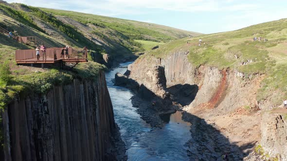 Drone View Jokulsa River in Stuolagil Canyon with Basalt Volcanic Rock Walls