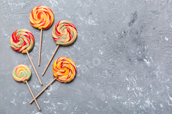 Set of colorful lollipops on colored background. Summer concept.