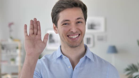 Hello Handsome Young Man Waving Hand to Welcome