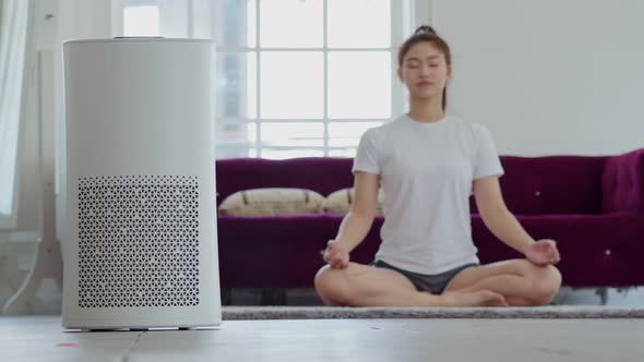 Air purifier in cozy white Living room for filter and cleaning removing dust PM2.5 HEPA at home