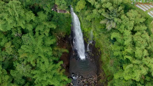 Exotic Curug Silawe waterfall surrounded by tropical landscape, Java, Indonesia