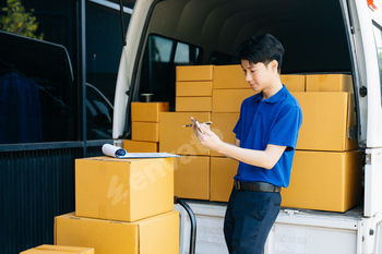 Portrait of courier delivery man searching the address on digital tablet. Delivery service,