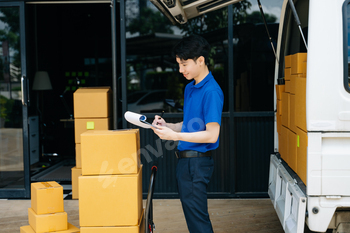 Portrait of courier delivery man searching the address on digital tablet. Delivery service,