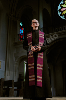 Old Priest in Church