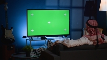 Man watching news on mockup TV