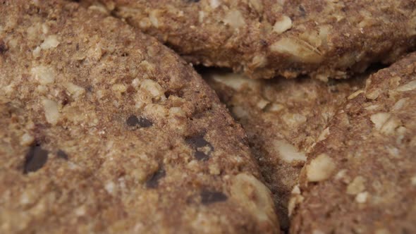 Oatmeal cookies close-up with chocolate pieces rotate
