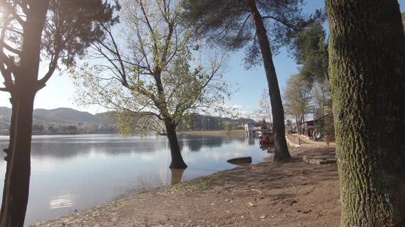 Shoreline of Tirana's Grand Park artificial lake on a sunny day in Albania