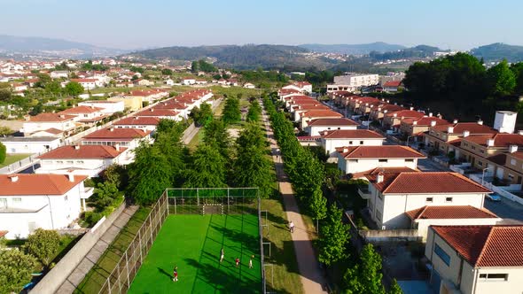 Fly Above City Park in Residential Area