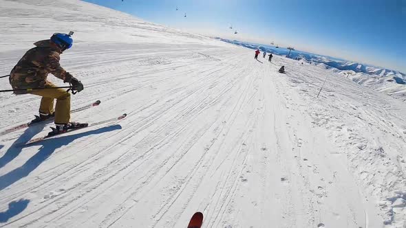 Skiers Riding on Snowy Slope