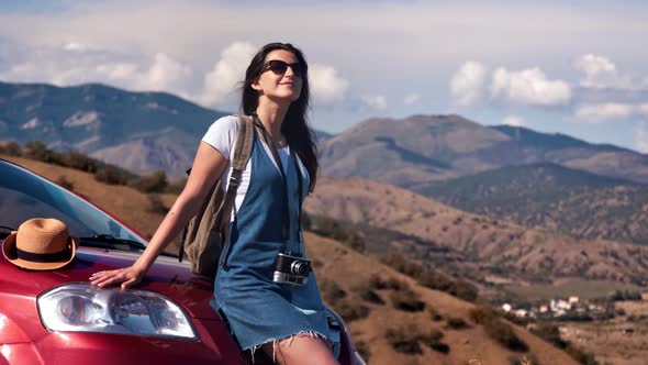 Carefree Travel Female During Car Journey Enjoying Break Surrounded By Mountain Park