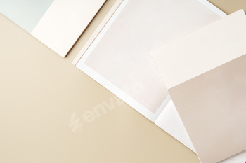 Stack of blank paper on beige background