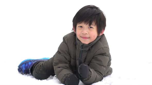 Cute Asian Child Playing On Snow In The Park