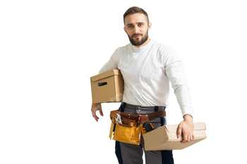 Portrait of a worker with tool and boxes