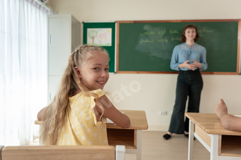 Portrait of Caucasian schoolgirl learn in classroom at elementary school.