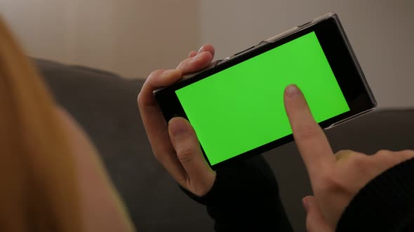 Touching mobile phone green screen 4K 2160p UHD video - Green screen smart phone in woman hands 4K 3