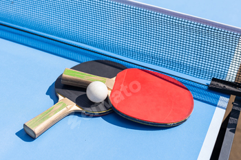 table tennis ball and paddle