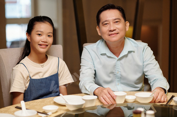 Dad And Daughter In The Restaurant