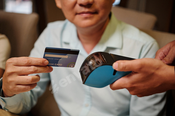 Man Paying With Credit Card In The Restaurant