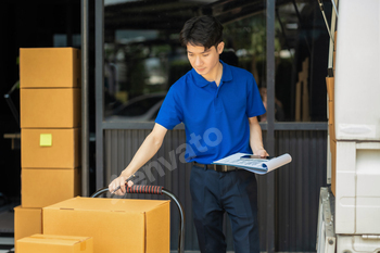 Asian delivery man, delivery men unloading cardboard boxes from truck.