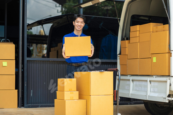 Asian delivery man, delivery men unloading cardboard boxes from truck.