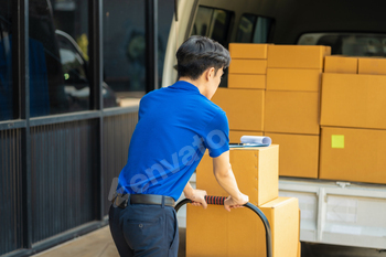 Asian delivery man, delivery men unloading cardboard boxes from truck.