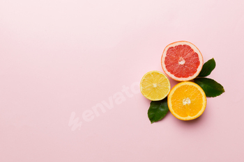 Fruit background. Colorful fresh fruits on colored table. Orange