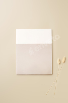 Stack of blank paper on beige background