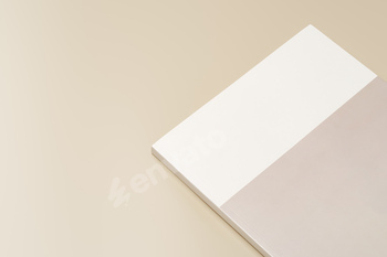 Stack of blank paper on beige background