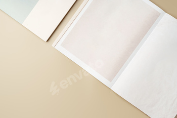 Stack of blank paper on beige background